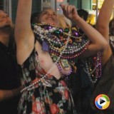 Drunk party girl doesnt notice her tits are still out as she tries to get more beads